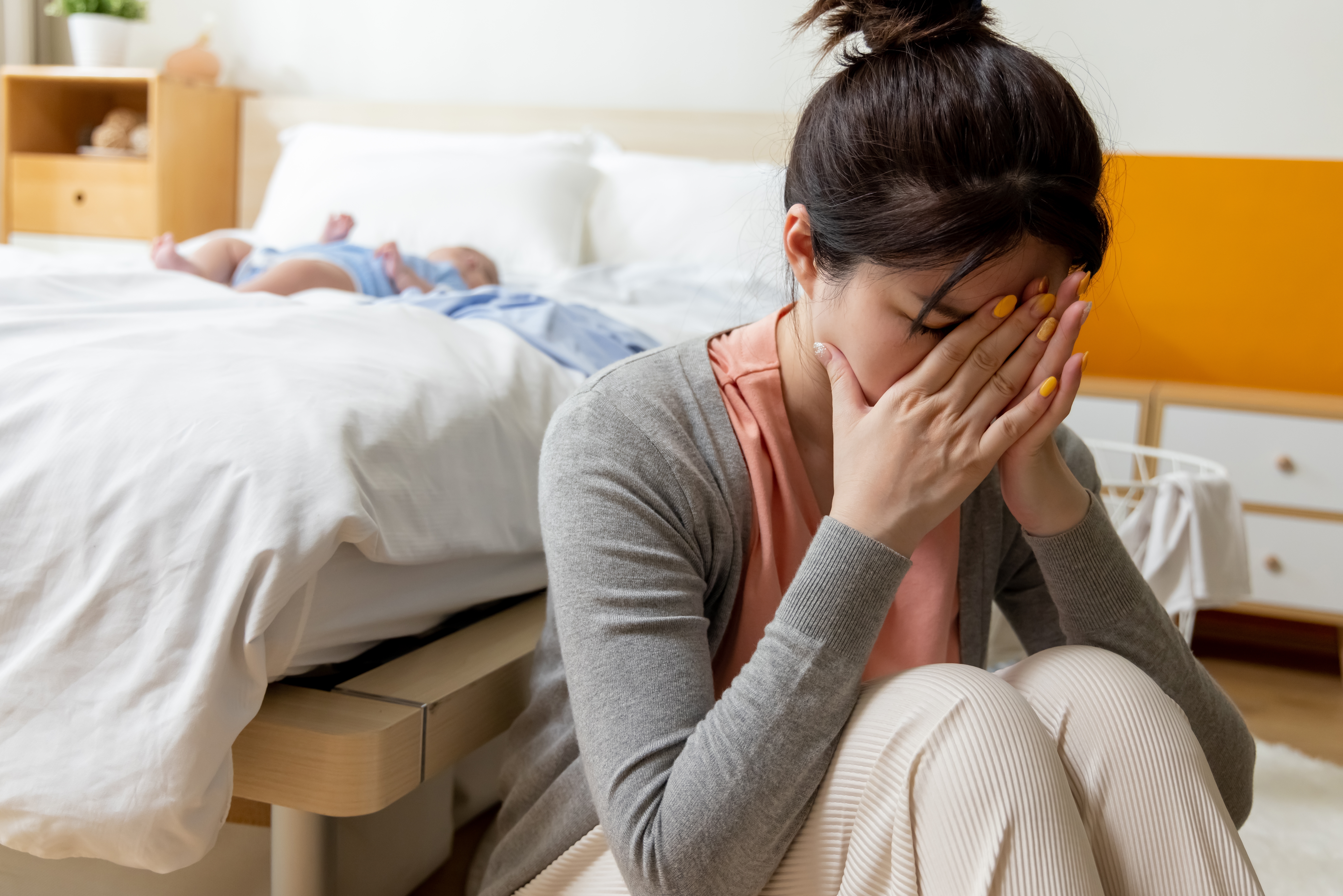 Authentic,shot,of,asian,mother,has,postpartum,depression,with,her
